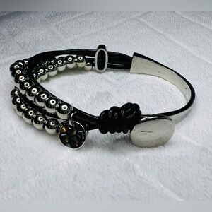 SILVER TONE AND BLACK FAUX LEATHER BRACELET NIP
